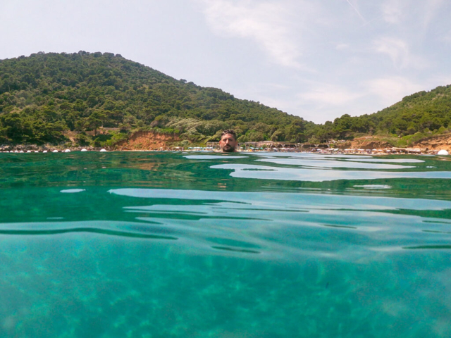 man swimming at Šunj Beach with a crystal clear water best beach in dubrovnik region