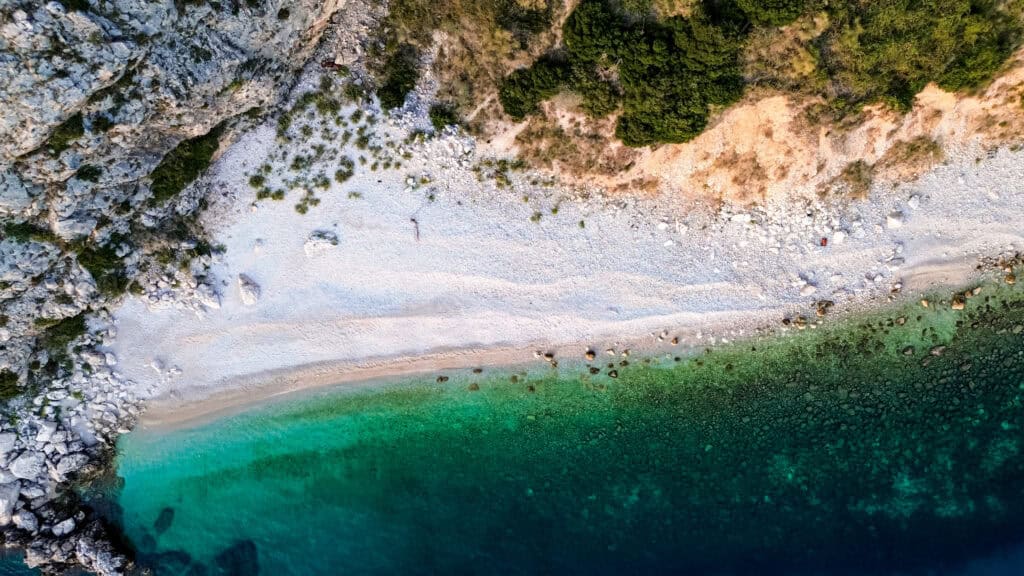 Secluded Beach Tri Brata, also known as Three Brothers, with crystal-clear waters and unique rock formations near Dubrovnik.